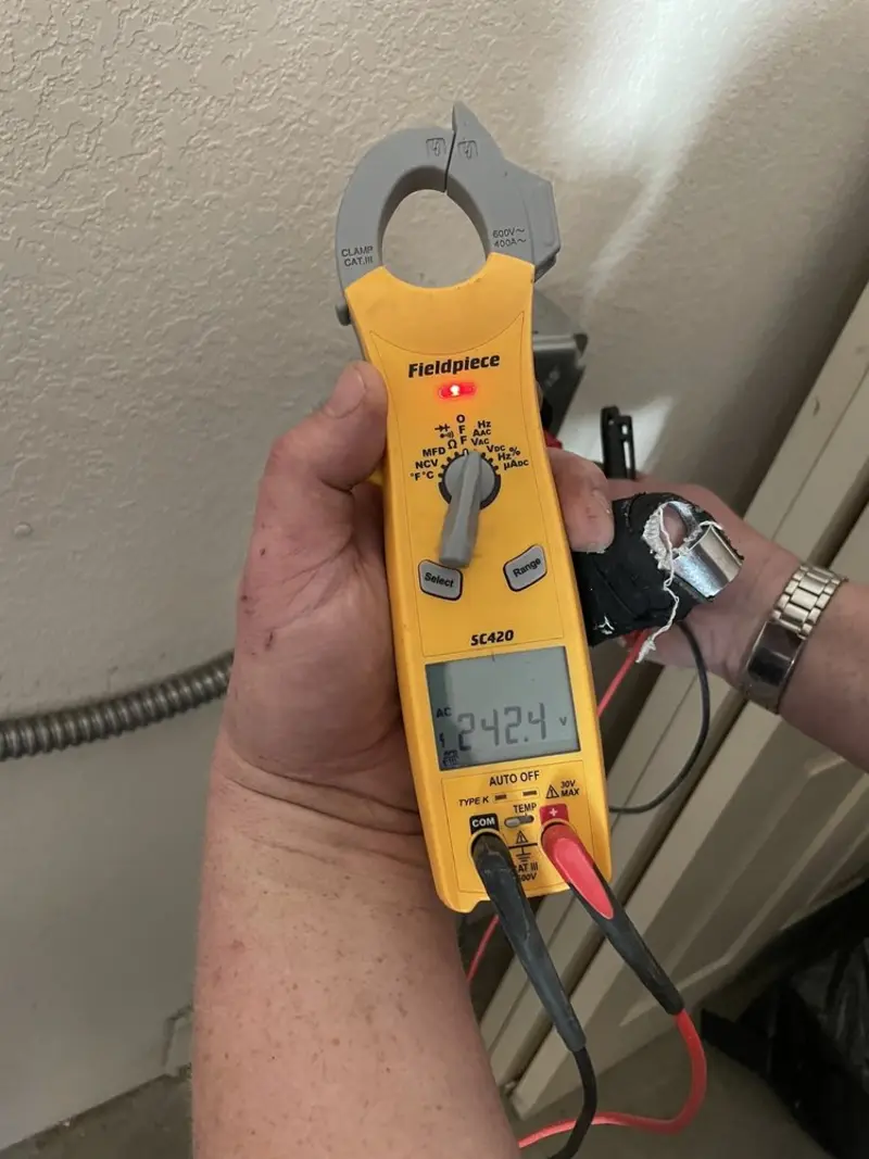 Voltage testing with clamp meter during Electrical Installation Services in Butler Beach